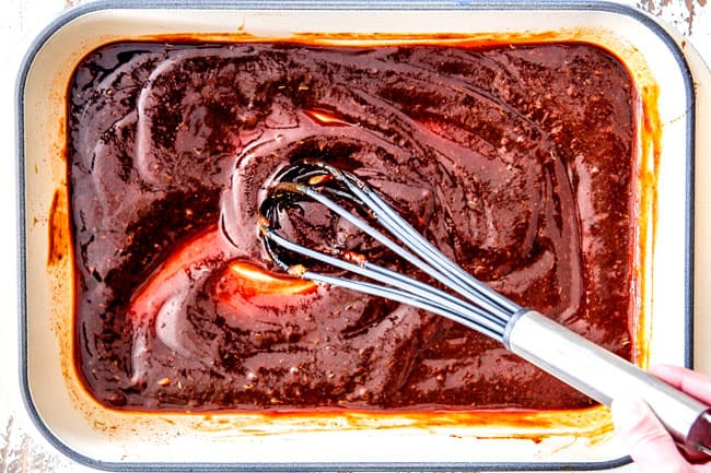 Showing How to make easy Baked Beans by stirring homemade sauce together