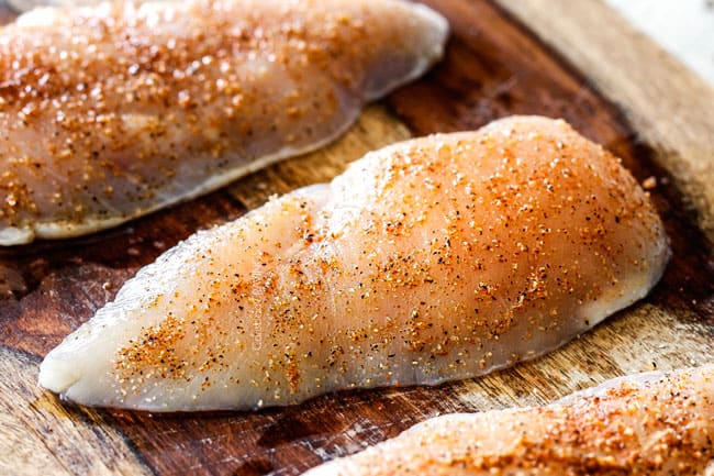 showing how to make Sun-Dried Tomato Pasta by rubbing chicken with a spice rub