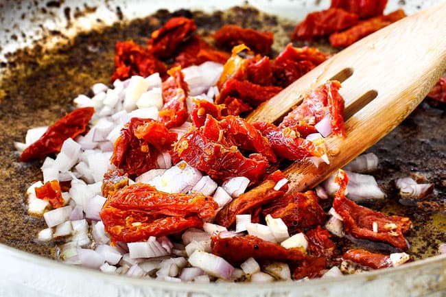 showing how to make Sun-Dried Tomato Pasta by sauteing sun-dried tomatoes and onions in a skillet