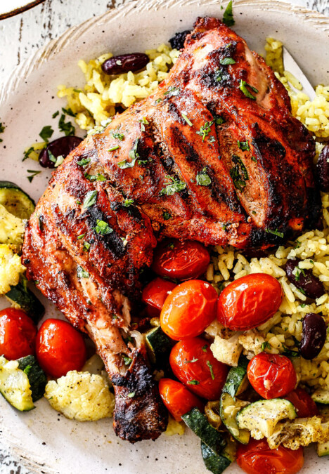 top view of authentic tandoori Chicken with Indian rice and roasted tomatoes