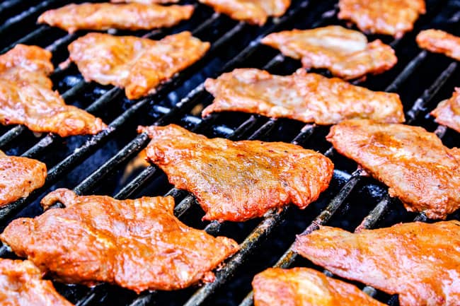 showing how to make Tacos Al Pastor by grilling thinly sliced marinated pork on the barbecue