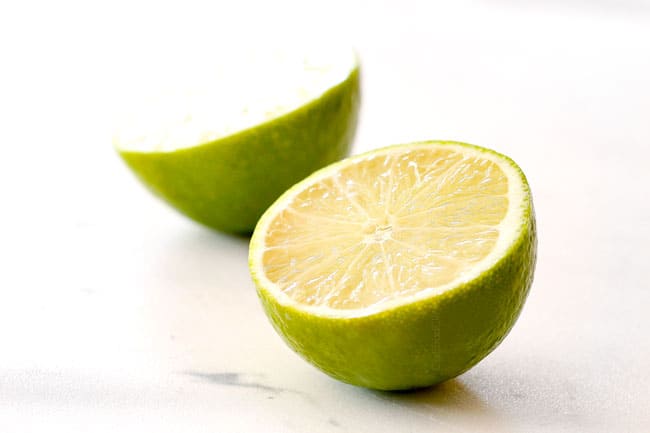 lime sliced in half showing how to make authentic pico de gallo