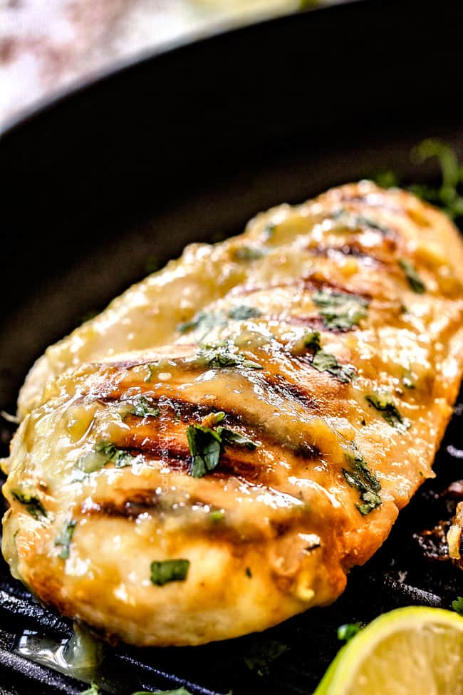 up close showing how to make salsa verde chicken by cooking salsa verde chicken in a grill pan