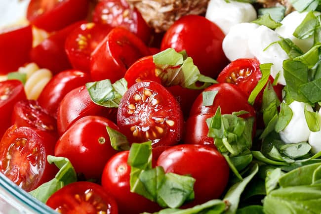 showing how to make caprese pasta salad with tomatoes