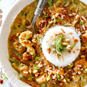 top view of Bang Bang Shrimp Copycat in a white bowl with a pile of rice in the center
