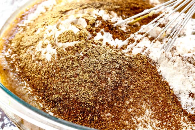 showing how to make easy pumpkin bars by whisking together the dry ingredients.