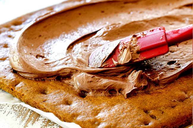 showing how to make pumpkin bars with cream cheese frosting by smoothing frosting over bars