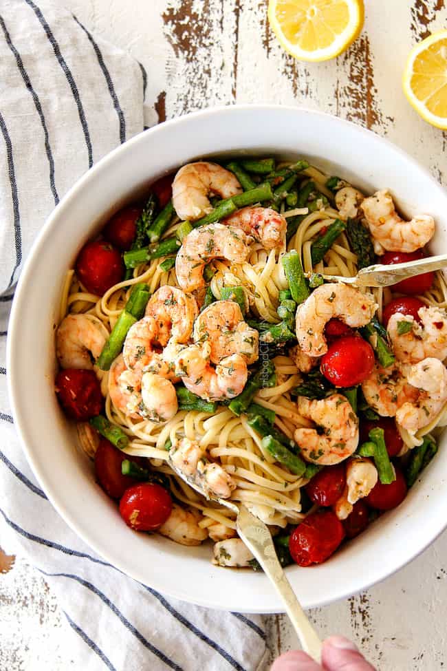 Shrimp Scampi Linguine in a large white bowl with a serving spoon