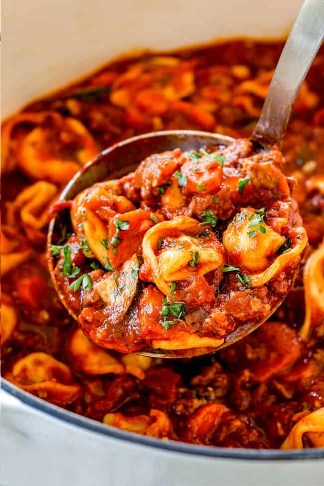 up close of sausage tortellini soup with spinach