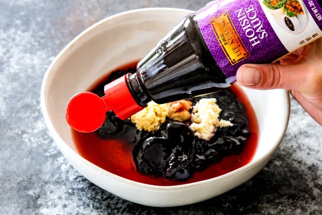 showing how to make hoisin chicken by by adding hoisin, blackberry preserves, vinegar, garlic and ginger to a bowl.