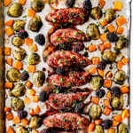 top view of hoisin chicken on a sheet pan with butternut squash and brussels sprouts