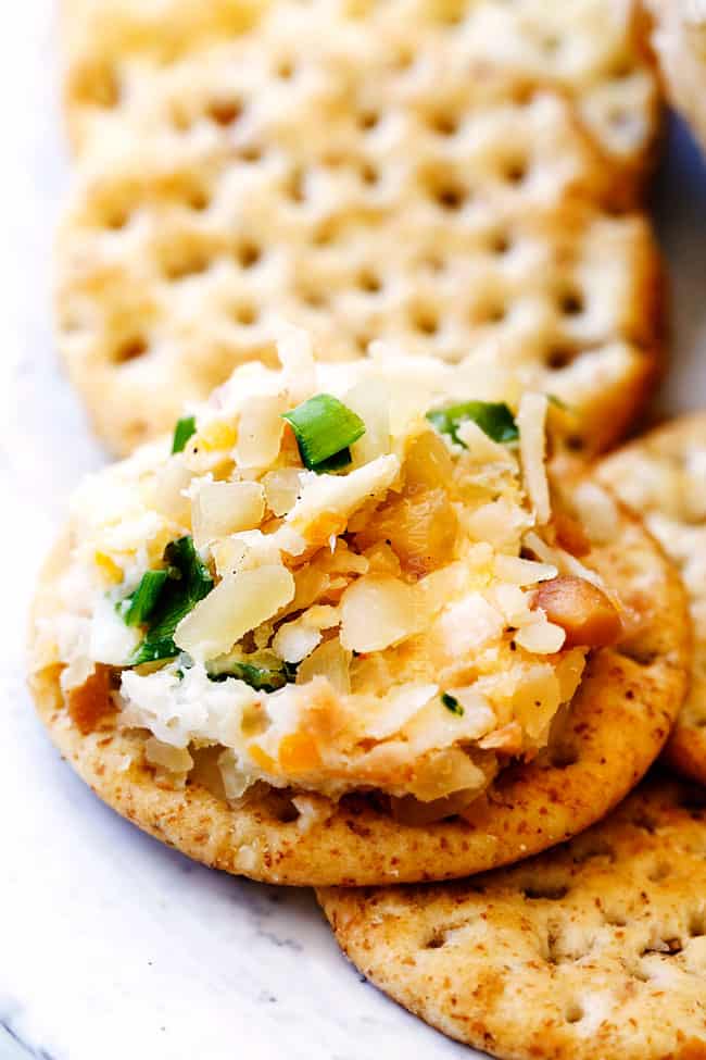 up close of Pineapple Cheese Ball spread on a cracker