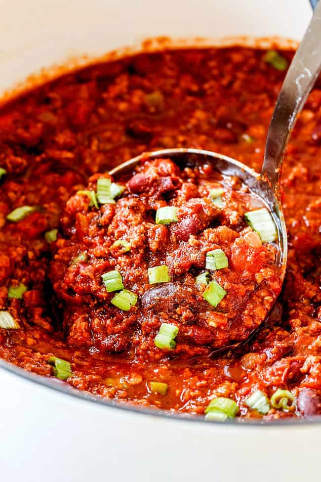 up close shot of a ladle scooping up turkey chili
