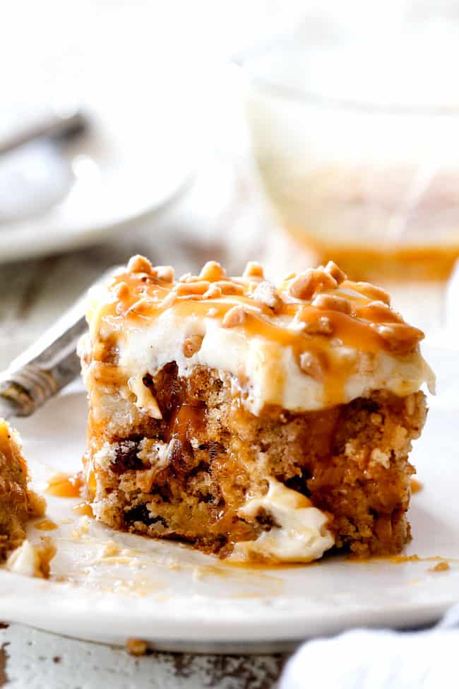 poke cake with a bite taken out of it oozing with caramel