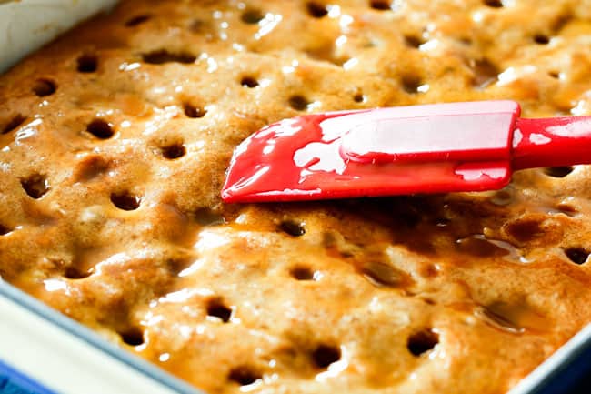 showing how to make poke cake by spreading caramel into holes o cake