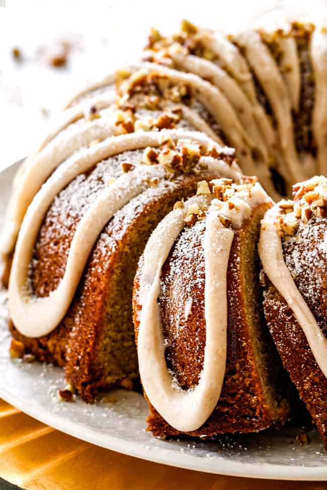slices of German eggnog cake on a white platter standing up
