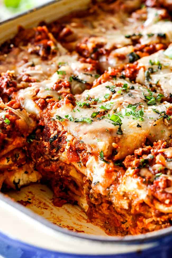 up close of side view of meat lasagna recipe cut into square serving slices