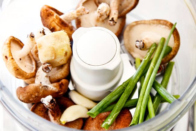 showing how to make wonton filling for easy Wonton Soup by adding ginger, garlic, mushrooms and green onions in a food processor