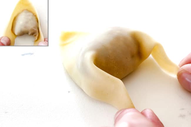 showing how to wrap wontons for wonton soup by Moisten opposite corners of the long side of triangle and fold them down