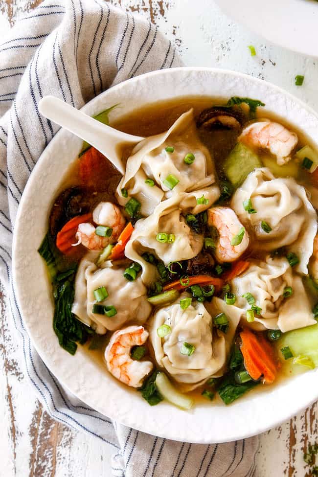 up close of easy wonton soup recipe in a white bowl