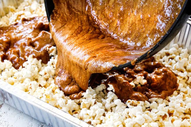 showing how to make caramel popcorn by pouring caramel sauce over popcorn