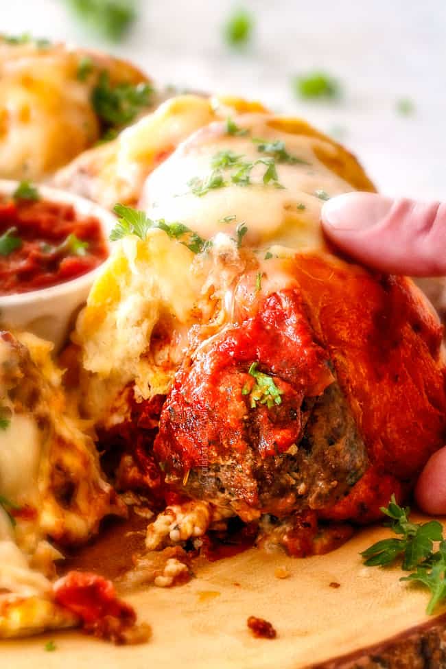up close of pull apart bread with a juicy meatball