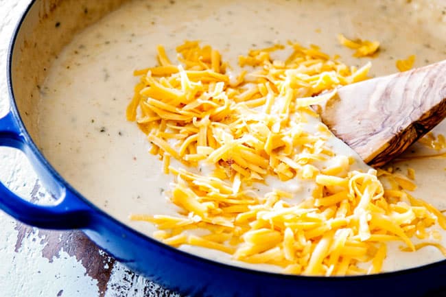 showing how to make from scratch chicken divan by adding cheese to homemade cream of chicken soup