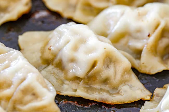 showing how to cook potstickers by frying the bottoms until crispy