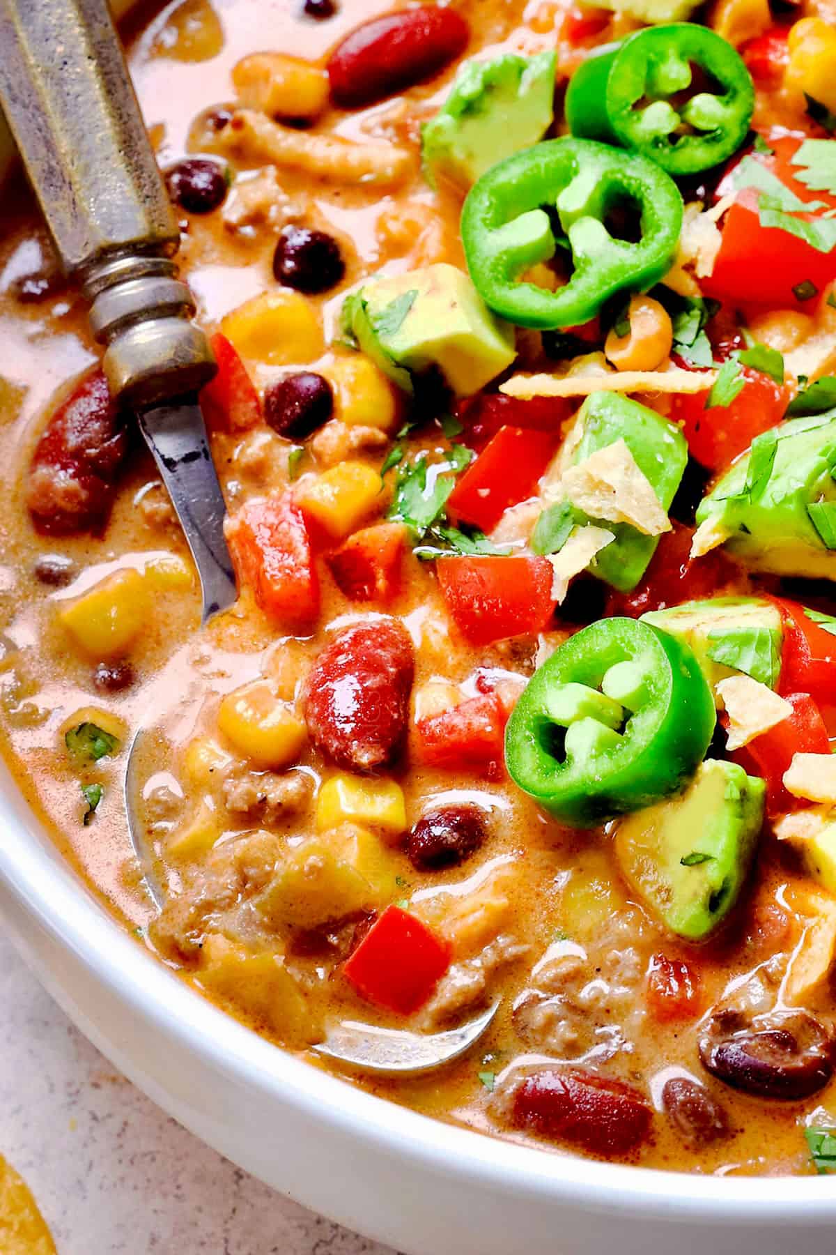 up close of scooping a spoonful of taco soup showing how creamy it is