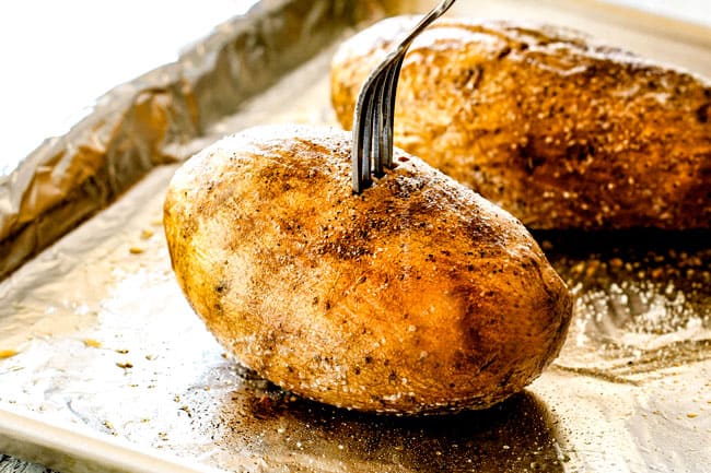showing how to make twice baked potatoes by piercing with a fork to show they are tener