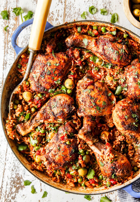 up close of arroz con pollo in a pot with peas