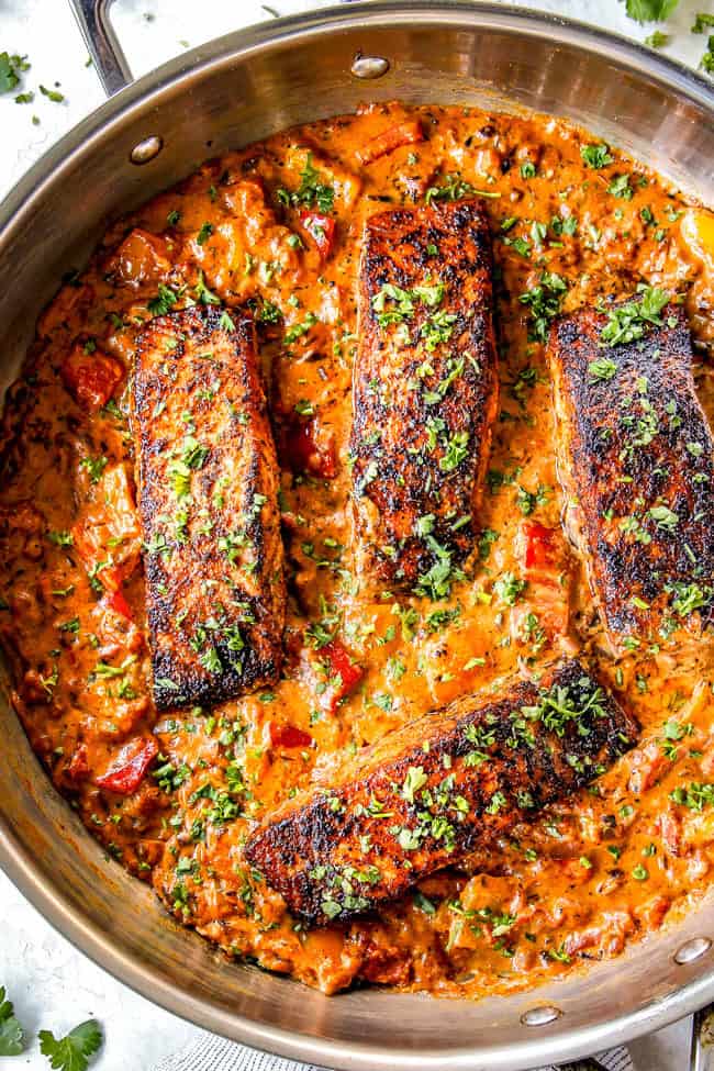 top view of easy blackened salmon in a stainless steal skillet