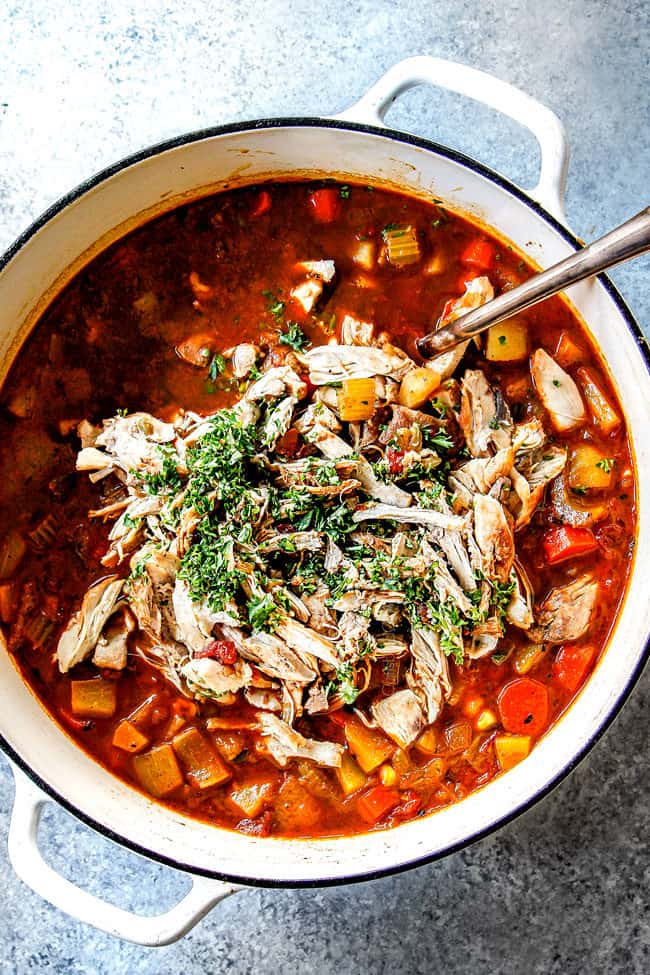 top view of Caldo de Pollo (Mexican Chicken Soup) with chicken ready to stir into the soup