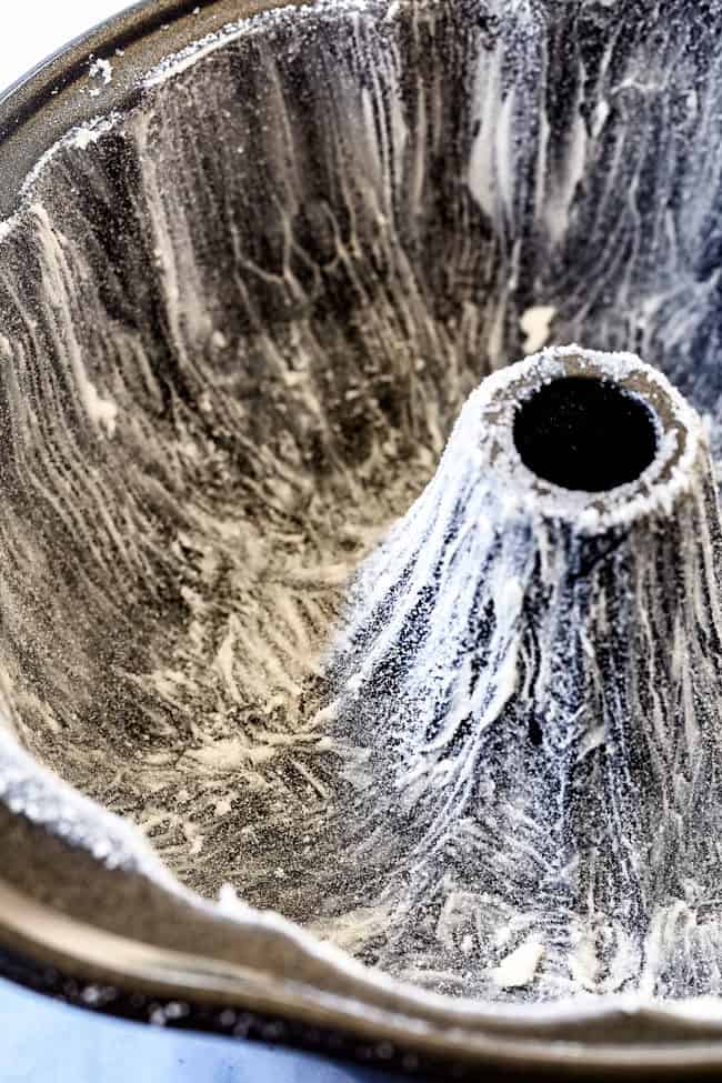 showing how to make Kentucky Butter Cake by dusting pan with sugar