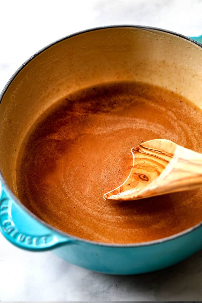 showing how to make Kentucky Butter Cake by stirring butter sauce