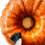 top view showing how to make Kentucky Butter Cake by brushing it with butter sauce