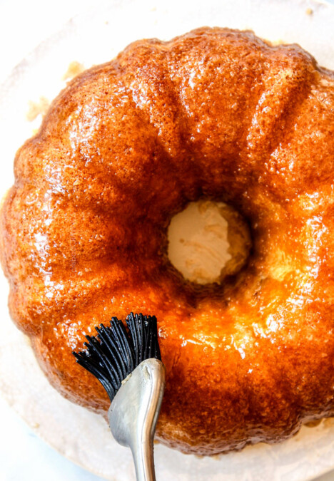 top view showing how to make Kentucky Butter Cake by brushing it with butter sauce