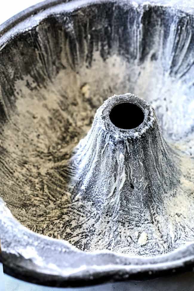 showing how to make Kentucky Butter Cake by dusting pan with flour