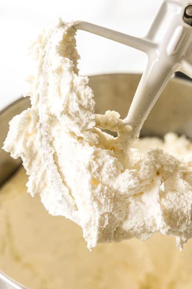 showing how to make Kentucky Butter Cake by beating sugar and butter until fluffy