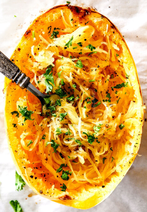 top view of baked spaghetti squash with a fork in the strands