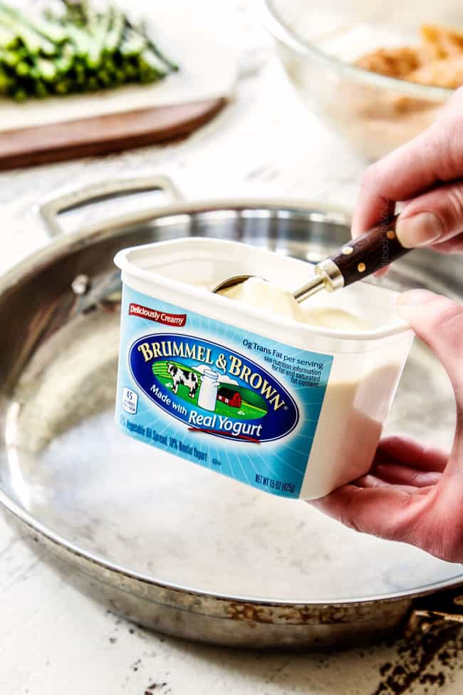 showing how to make lemon pepper chicken by adding butter to skillet