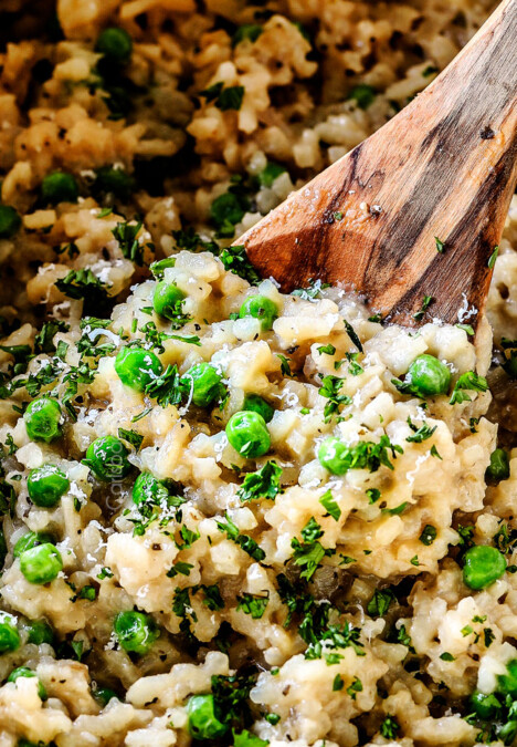 showing how to make risotto by stirring cooked risotto rice