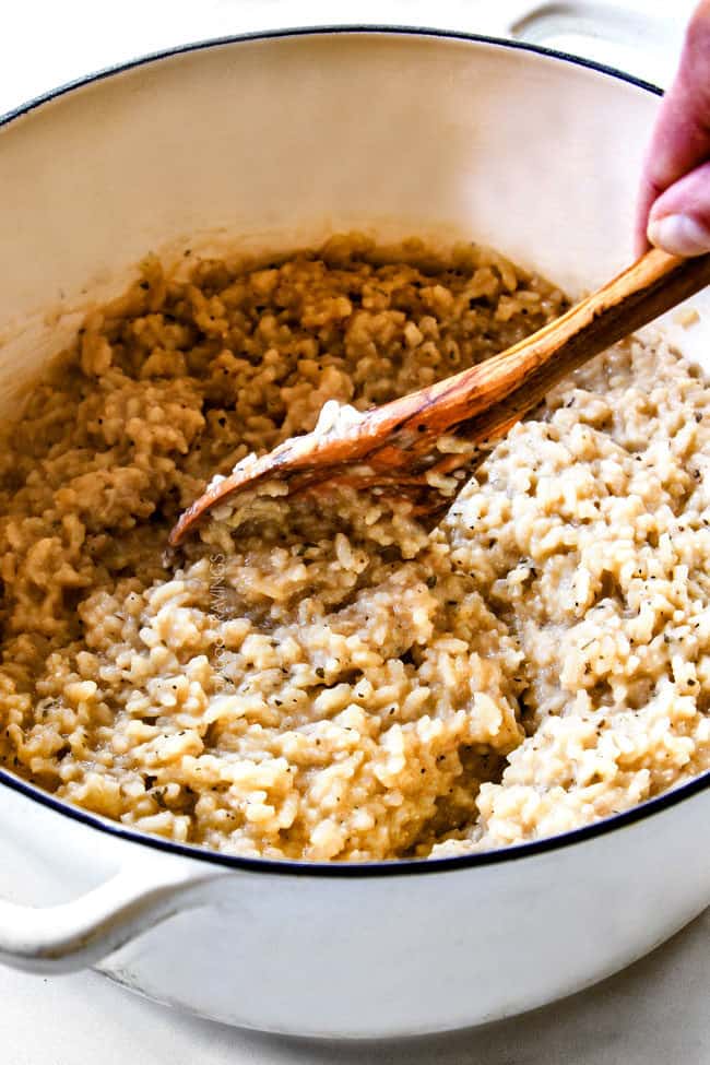showing how to make risotto by stirring cooked risotto rice