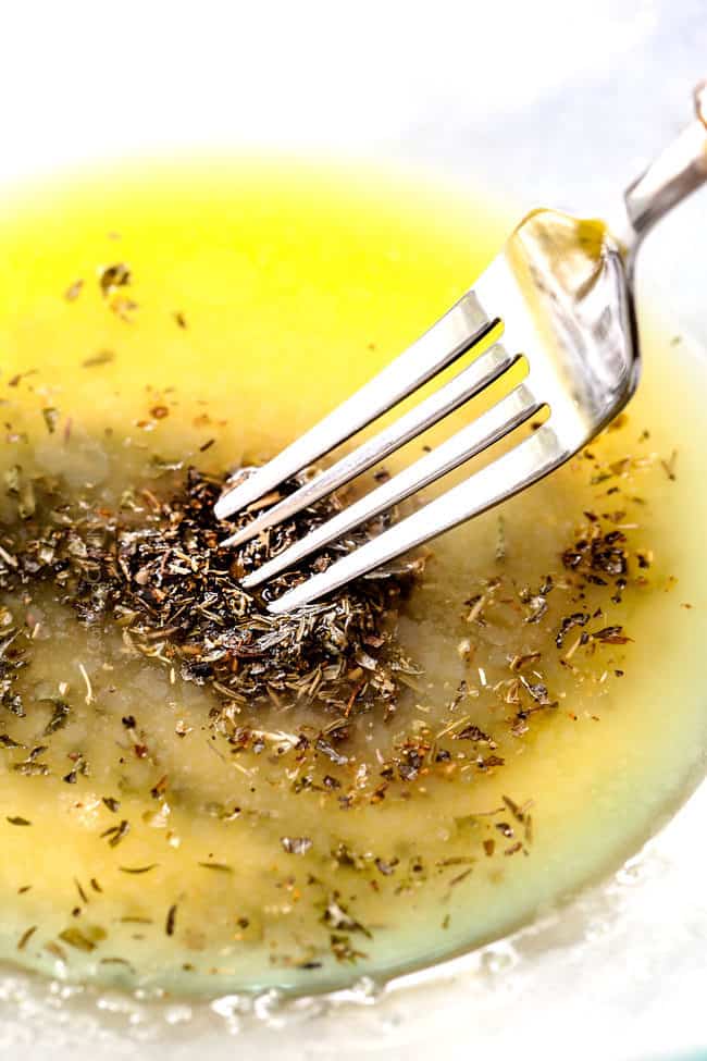 showing how to make smashed potatoes by making garlic herb buttr