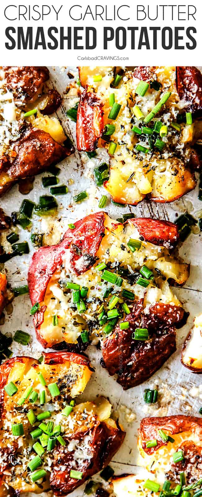 top view of garlic smashed potatoes lined on a baking sheet