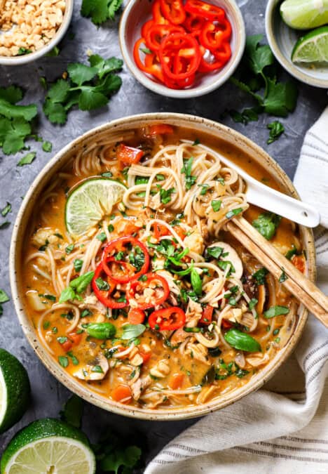 top view of Thai Chicken Soup in a bowl with noodles