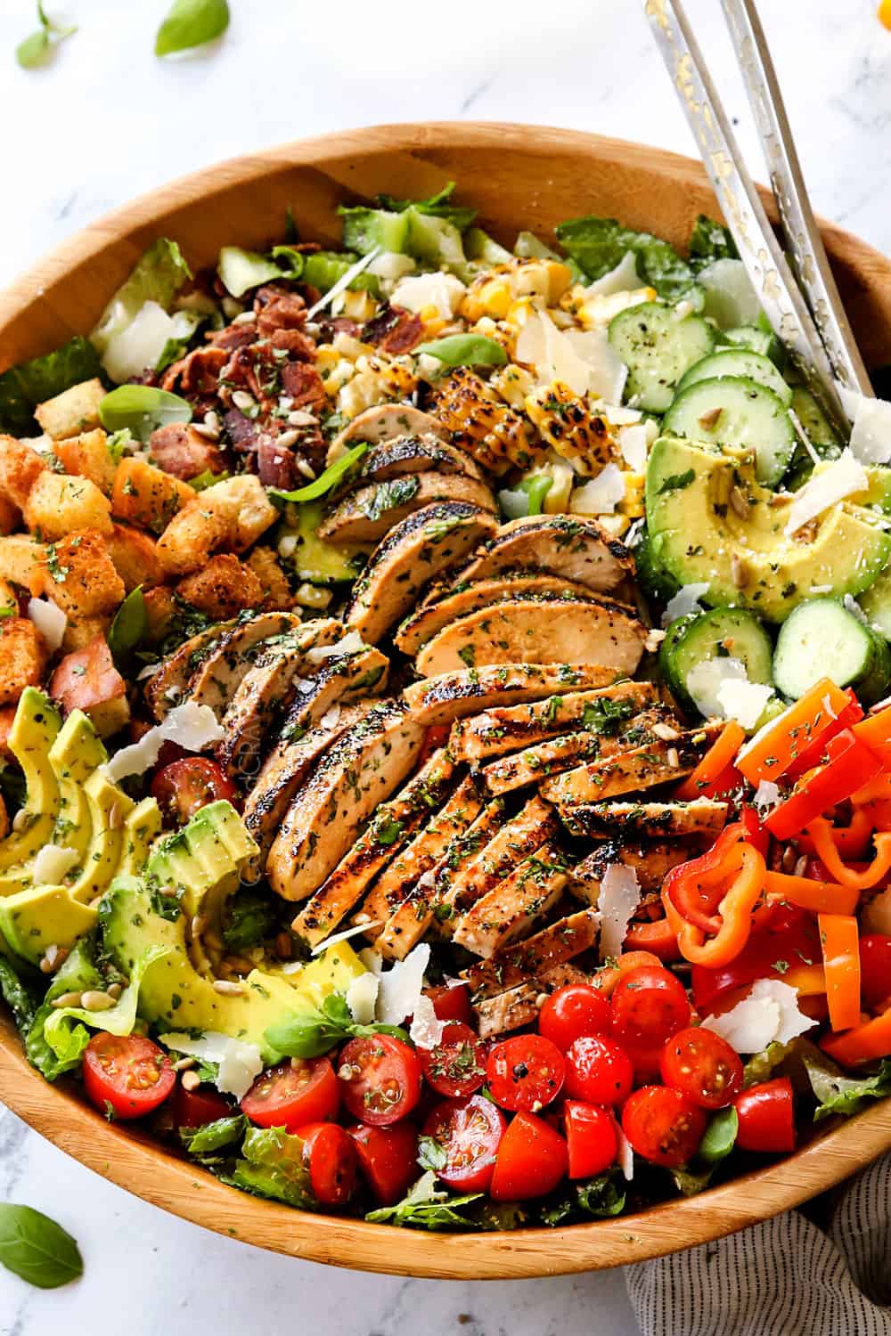 a bowl of Chicken Caesar Salad with grilled chicken, Caesar dressing and croutons