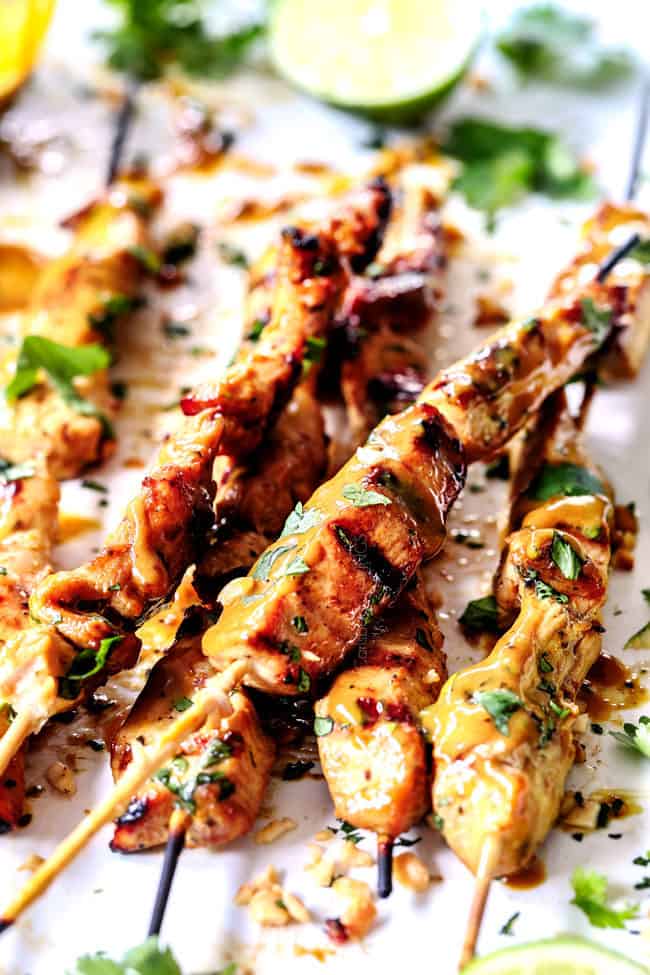 thai chicken satay with peanut sauce threaded on skewers