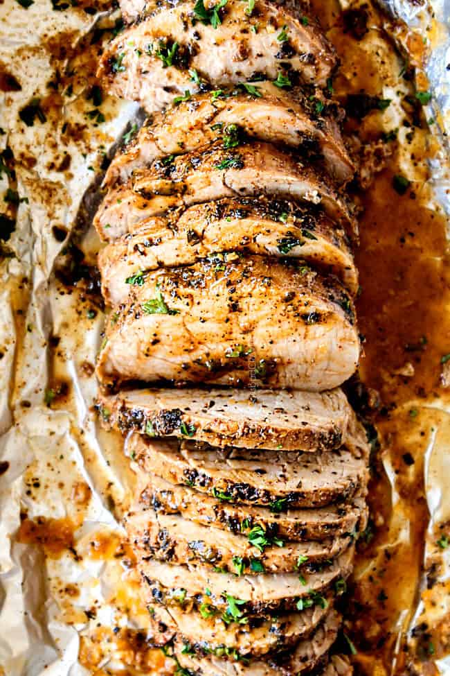 easy pork tenderloin oven sliced on a cutting board