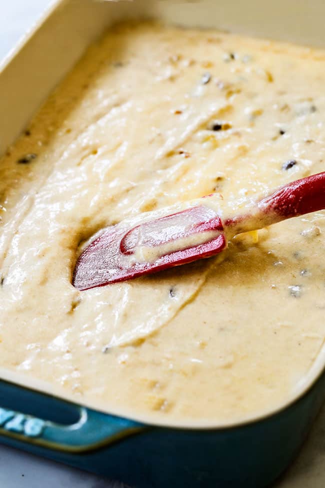 showing how to make banana cake by spreading cake batter in a 9x13 pan